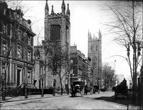 Image of Fifth Avenue looking north from E. 10th Street, Church of the Ascension foreground, First Presbyterian Church further up (about 1900).